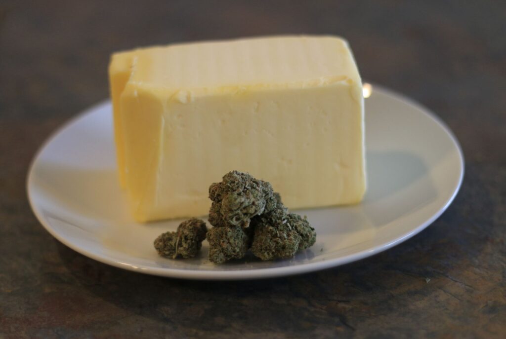 A plate of butter with about 3 grams of bud - front view