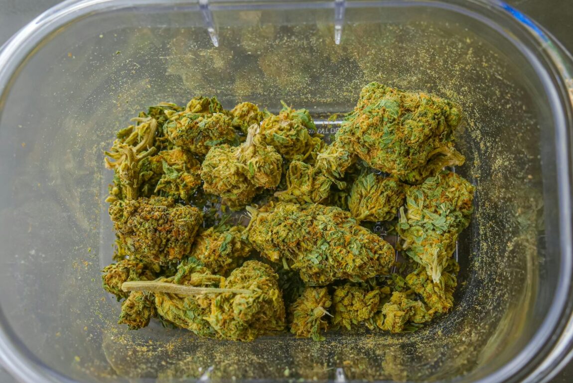 Photo of Cannabis Flowers on Glass Container